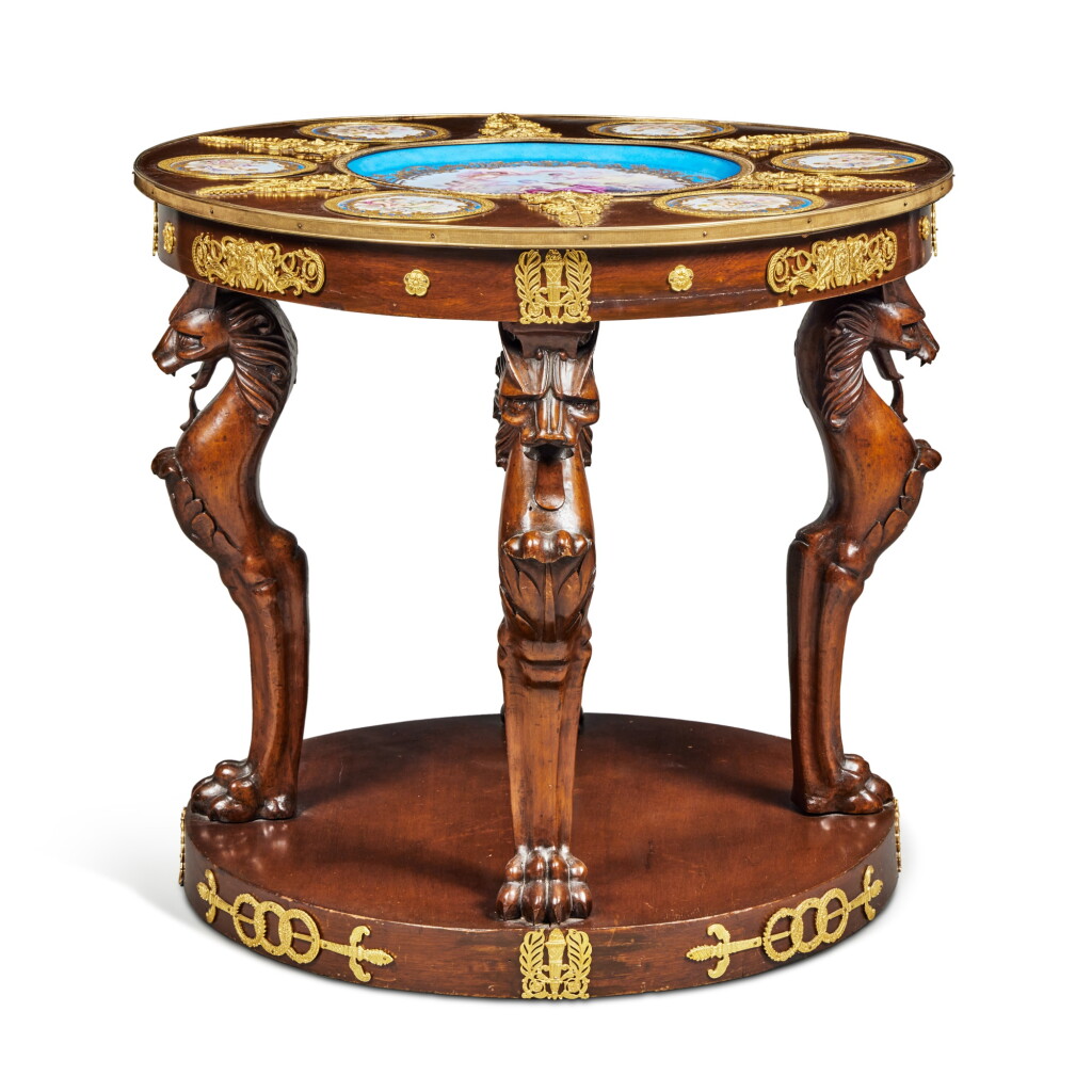 View full screen - View 1 of Lot 408. An Empire Style Gilt-Bronze Mounted and Sevres Style Porcelain Inlaid Mahogany Center Table, Late 19th Century and Later.