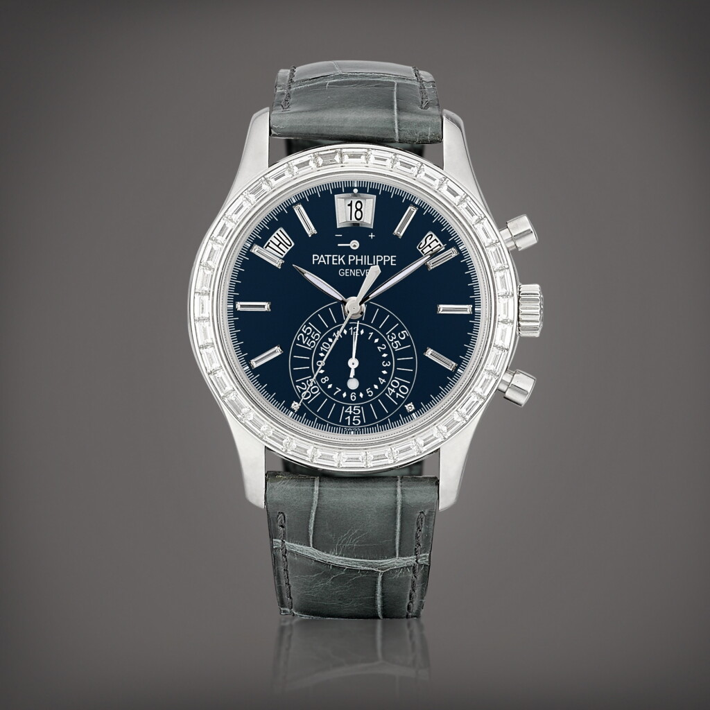 View full screen - View 1 of Lot 701. Reference 5961 | A platinum and diamond-set annual calendar flyback chronograph wristwatch with power reserve and day and night indication, Circa 2012 | 百達翡麗 | 型號 5961 | 鉑金鑲鑽石年曆飛返計時腕錶,備動力儲備及晝夜顯示,約2012年製.