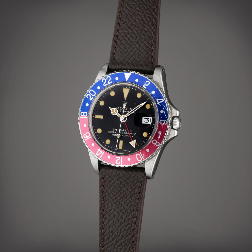 View full screen - View 1 of Lot 38. Reference 1675 GMT-Master 'Fuschia' | A stainless steel automatic dual time wristwatch with date, Circa 1962.