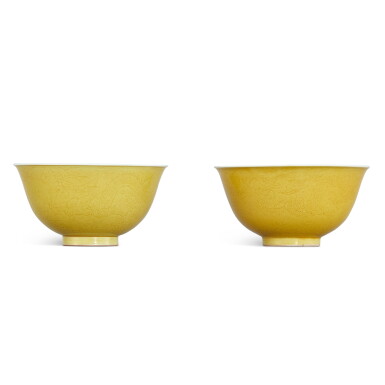 View full screen - View 1 of Lot 304. A pair of incised yellow-glazed 'dragon' bowls, Seal marks and period of Jiaqing 清嘉慶 黃釉暗刻雲龍趕珠紋盌一對 《大清嘉慶年製》款.