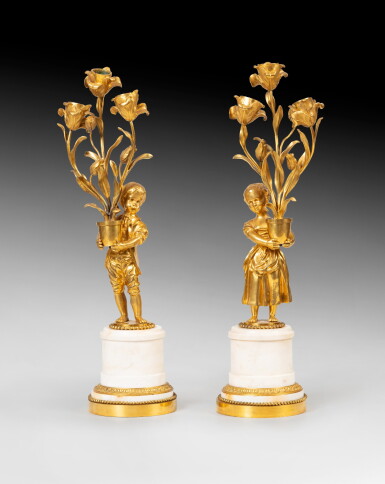 View full screen - View 1 of Lot 69. A pair of ormulu and white marble three-light candelabra, French Restauration, circa 1830 | Paire de candélabres à trois lumières en bronze doré et marbre blanc d'époque Restauration, vers 1830.