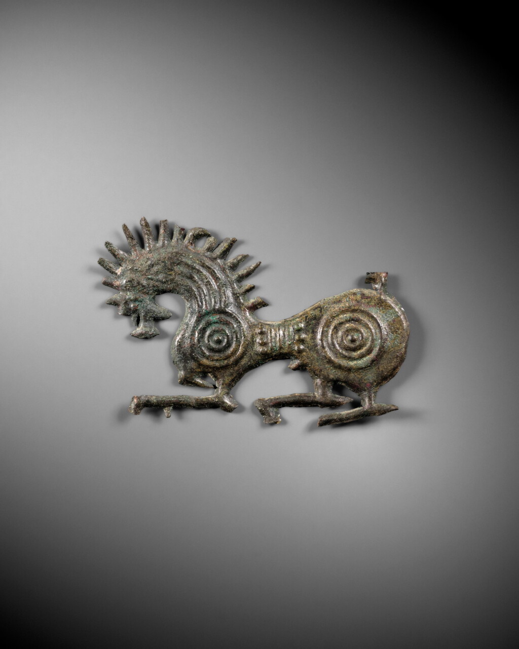 View full screen - View 1 of Lot 5. A Repoussé Bronze Applique, Iran, 1st Millennium B.C..
