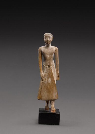 View full screen - View 1 of Lot 205. An Egyptian Wood Figure of a Man, 6th Dynasty, reign of Pepi II, circa 2246-2152 B.C..