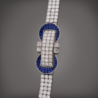 View full screen - View 1 of Lot 86. A mystery-set sapphire and diamond concealed bracelet watch, Circa 1946.