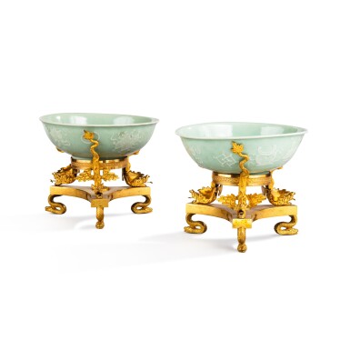 View full screen - View 1 of Lot 83. A pair of Chinese celadon porcelain bowls, probably Kangxi period (1662-1772) and gilt-bronze mounted, possibly England, 19th century | Paire de coupes en porcelaine céladon de Chine, probablement d’époque Kangxi (1662-1722) et monture de bronze doré, peut-être Angleterre, XIXe siècle.