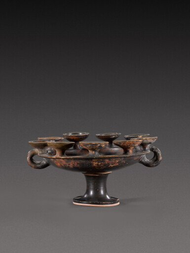 View full screen - View 1 of Lot 180. An Apulian Black-Glazed Kernos, circa 4th/3rd Century B.C..