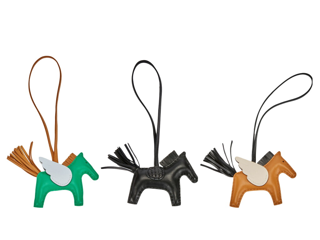View full screen - View 1 of Lot 216. A Set of Three Rodeo Charms.