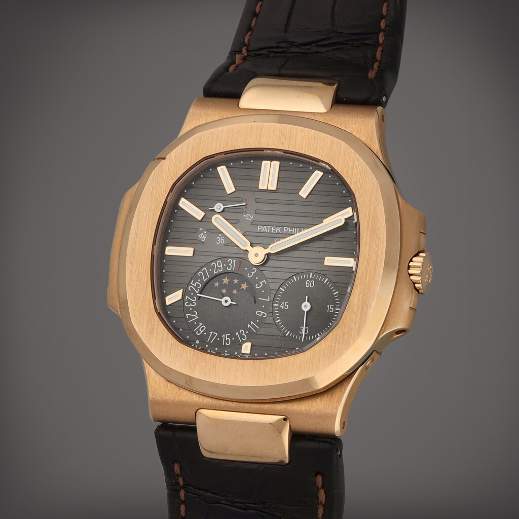 View full screen - View 1 of Lot 31. Nautilus, Reference 5712R-001 A pink gold wristwatch with date, moon phases and power reserve indication Circa 2019.