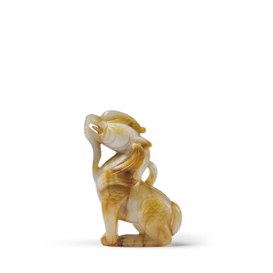 View full screen - View 1 of Lot 127. A celadon and russet jade figure of a crouching mythical beast, Qing dynasty.
