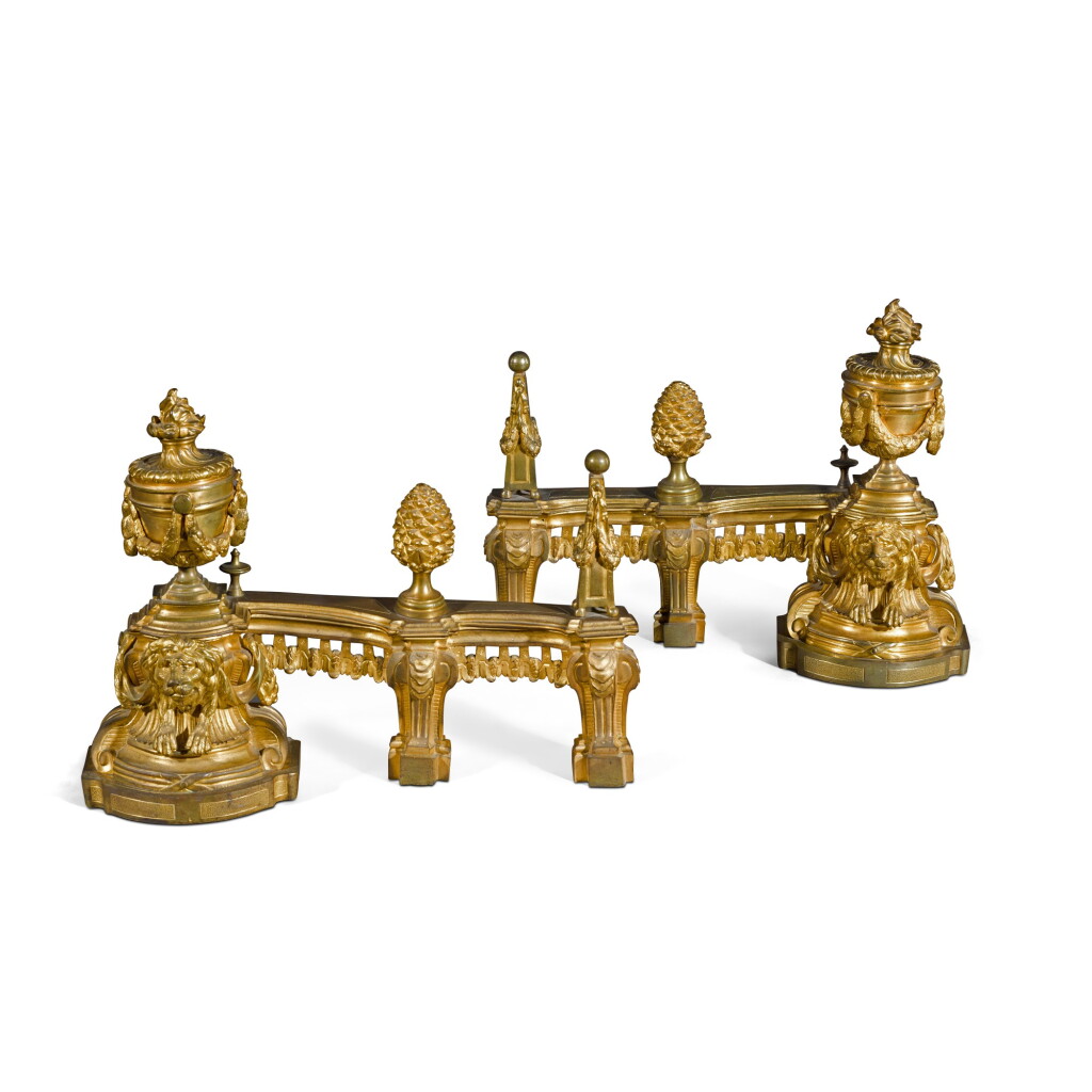 View full screen - View 1 of Lot 38. A PAIR OF LOUIS XVI STYLE GILT-BRONZE CHENETS, CIRCA 1860.