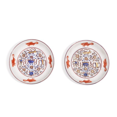 View full screen - View 1 of Lot 336. A pair of underglaze-blue, iron-red and gilt decorated 'Precious objects and Bajixiang' saucer dishes, Qing dynasty, Kangxi period | 清康熙 青花礬紅彩描金八吉祥紋小盤一對.