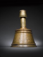 A large Mamluk brass candlestick, made for Sayf al-Din Hatim Dawadar, Egypt, circa 1500