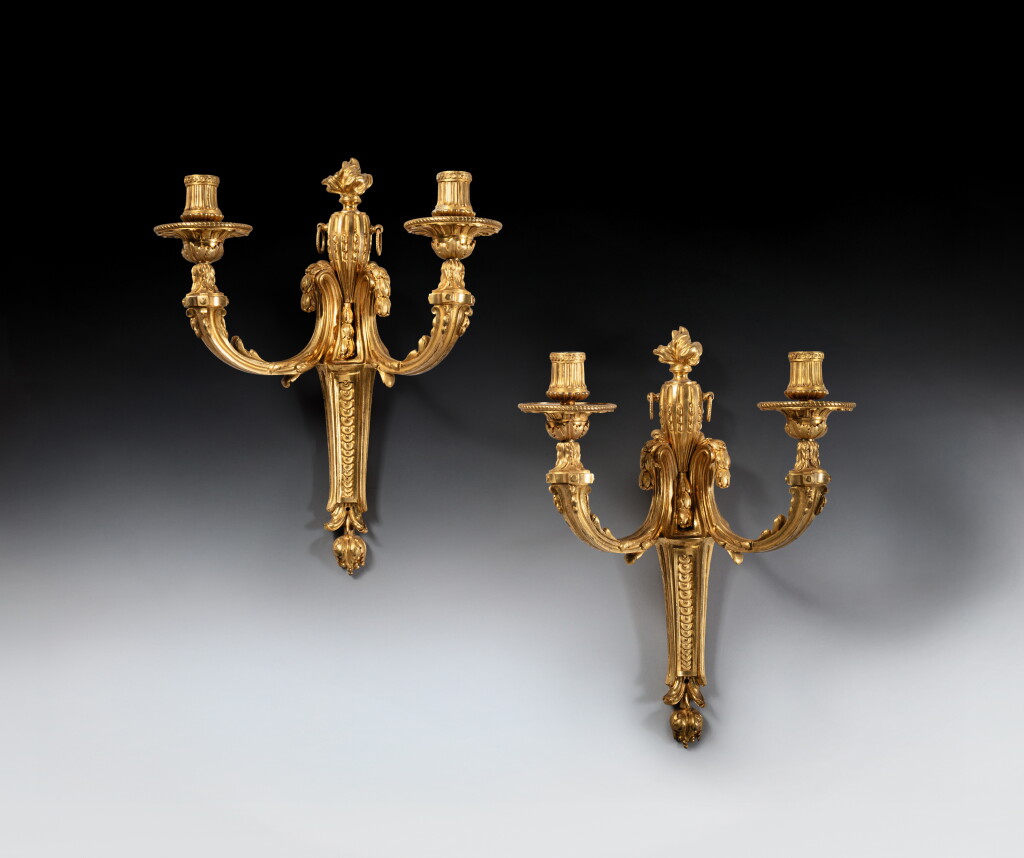 View full screen - View 1 of Lot 249. A pair of late Louis XV gilt-bronze two-light wall-appliques, circa 1765.