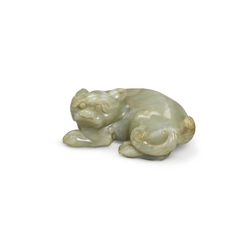 View full screen - View 1 of Lot 137. A celadon jade figure of a mythical beast, Ming dynasty | 明 青玉瑞獸.