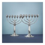 A PAIR OF DANISH SILVER SEVEN LIGHT CANDELABRA, NO. 488, DESIGNED BY HARALD NIELSEN, GEORG JENSEN SILVERSMITHY, COPENHAGEN, CIRCA 1925-32