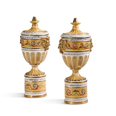 View full screen - View 1 of Lot 67. A pair of Sèvres-style apricot-ground two-handled urns and covers, 20th century.