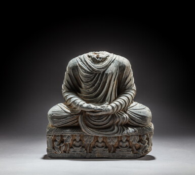 View full screen - View 1 of Lot 102. A gray schist headless figure of Dhyana Buddha, Ancient region of Gandhara, circa 2nd / 4th century | 犍陀羅 約二 / 四世紀 灰片岩雕佛坐像.