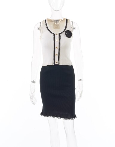 View full screen - View 1 of Lot 5. CHANEL | BLACK AND OFF-WHITE TANK TOP AND SKIRT WITH CAMELLIA BROOCH .