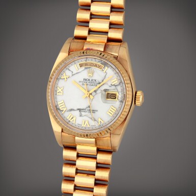 View full screen - View 1 of Lot 210. Day-Date, Reference 18038 | A yellow gold wristwatch with marble dial, day, date and bracelet | Circa 1984.