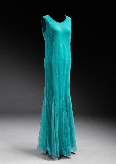 View full screen - View 1 of Lot 318. Haute Couture silk gown embellished with turquoise tulle, a coral jacket embroidered with flowers and raffia (label missing) with a pair of heels Delage.