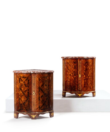 View full screen - View 1 of Lot 63. A pair of Louis XV gilt-bronze and gilt brass mounted kingwood and Rio rosewood parquetry encoignures, circa 1730.