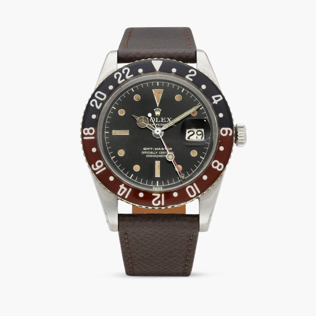 View full screen - View 1 of Lot 27. GMT-Master, Reference 6542 | A stainless steel dual time zone wristwatch with date and bakelite bezel | Circa 1956.