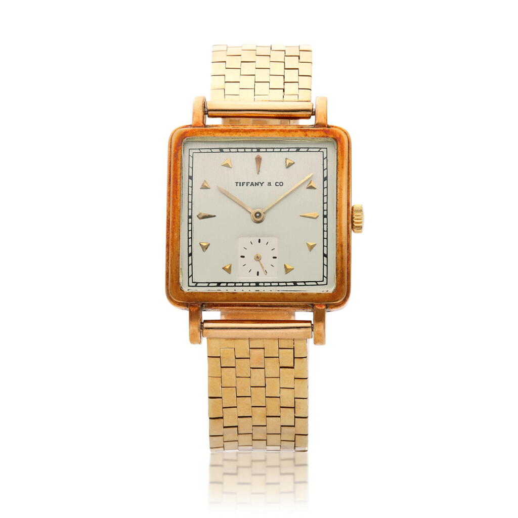 View full screen - View 1 of Lot 245. Retailed by Tiffany & Co.: A yellow gold square form wristwatch, Circa 1960.