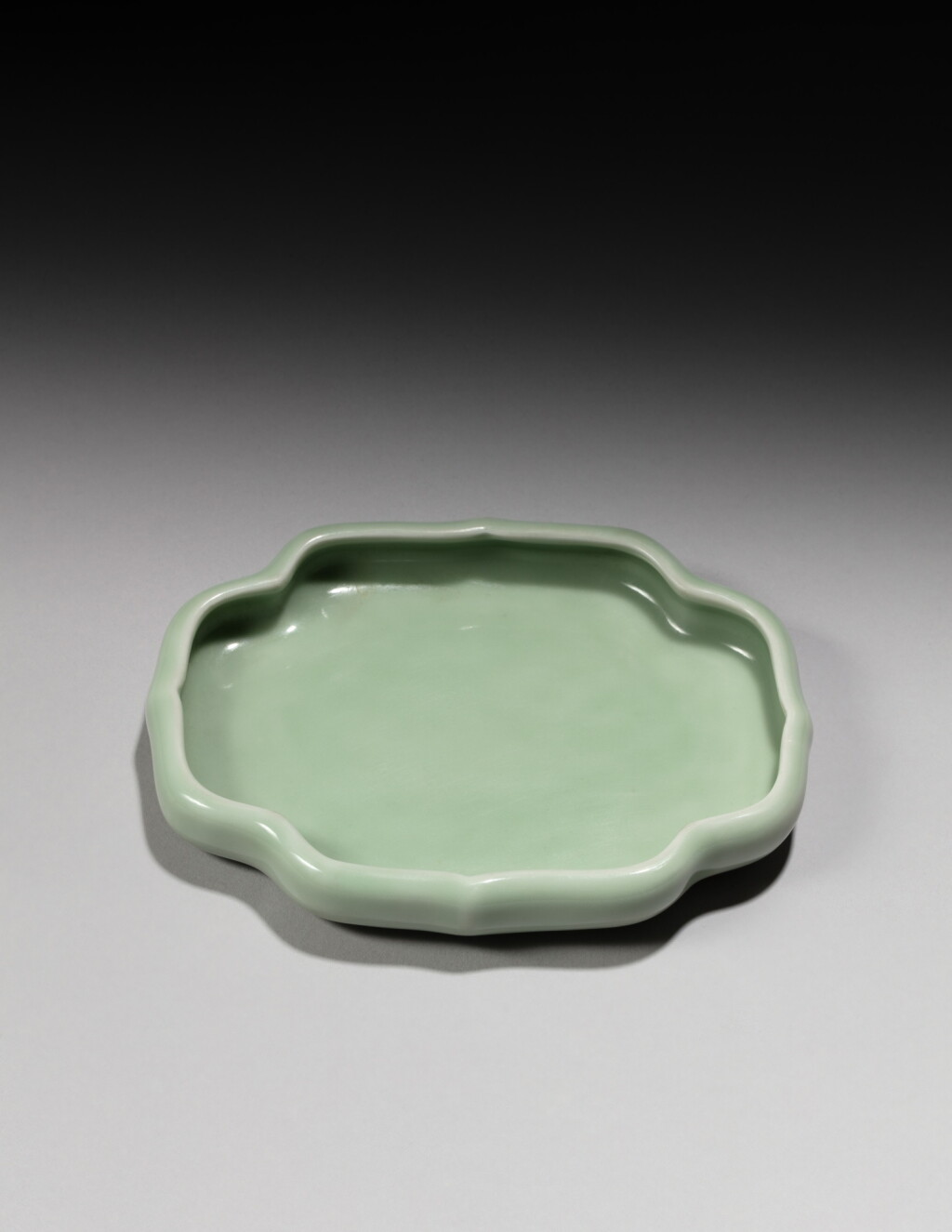 View full screen - View 1 of Lot 163. A celadon-glazed lobed washer, Seal mark and period of Daoguang | 清道光 青釉海棠式洗 《大清道光年製》款.