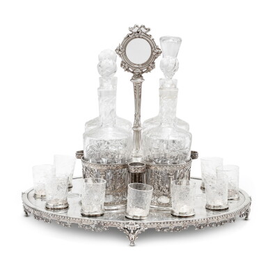 View full screen - View 1 of Lot 111. A Louis XVI style silver and cut glass liquor cabinet, probably Paul Canaux & Cie, Paris, 1892-1911 | Cabaret à liqueurs de style Louis XVI en argent et verre taillé probablement par Paul Canaux & Cie, Paris, 1892-1911.