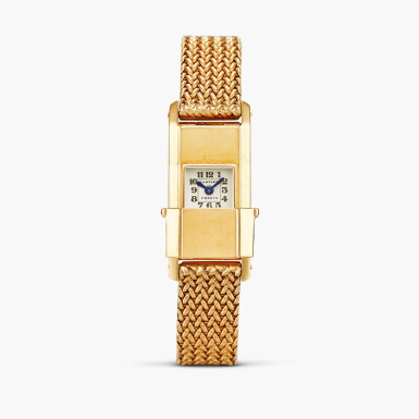 View full screen - View 1 of Lot 2487. Baguette Coulissante | An unusual rectangular yellow gold lady’s rear-wound wristwatch with sliding protective dial cover and gold bracelet with deployant buckle, Circa 1945-46.