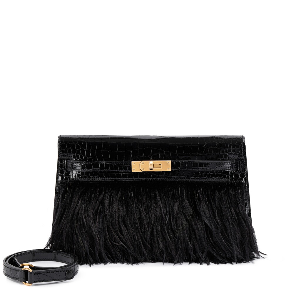 View full screen - View 1 of Lot 521. Limited Edition Black Shiny Porosus Crocodile and Ostrich Feather Kelly Elan Gold Hardware, 2023.