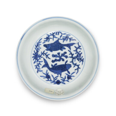 View full screen - View 1 of Lot 3. A blue and white 'fish' dish, Mark and period of Wanli | 明萬曆 青花魚藻紋盤 《萬曆年造》、《德化長春》款.