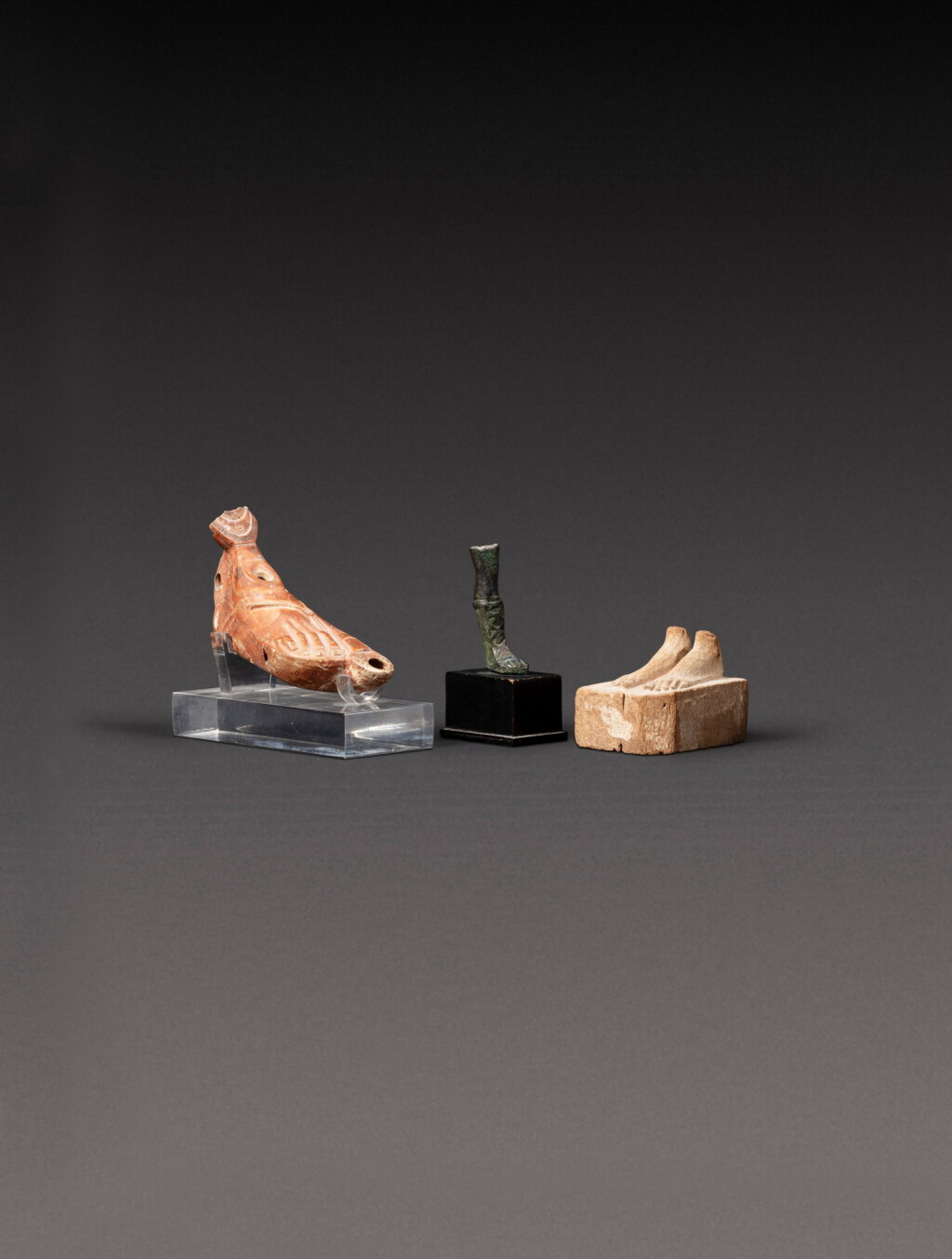 View full screen - View 1 of Lot 121. Three Antiquities, circa 4th Century B.C./3rd Century A.D..