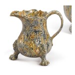 A STAFFORDSHIRE SOLID-AGATE CREAM JUG, CIRCA 1750