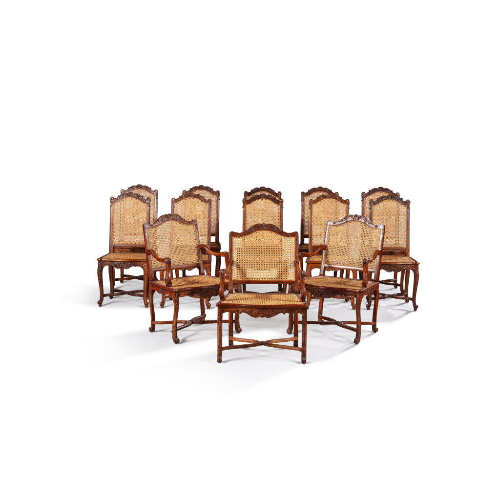 View full screen - View 1 of Lot 549. A set of twenty-two walnut dining chairs, circa 1900.