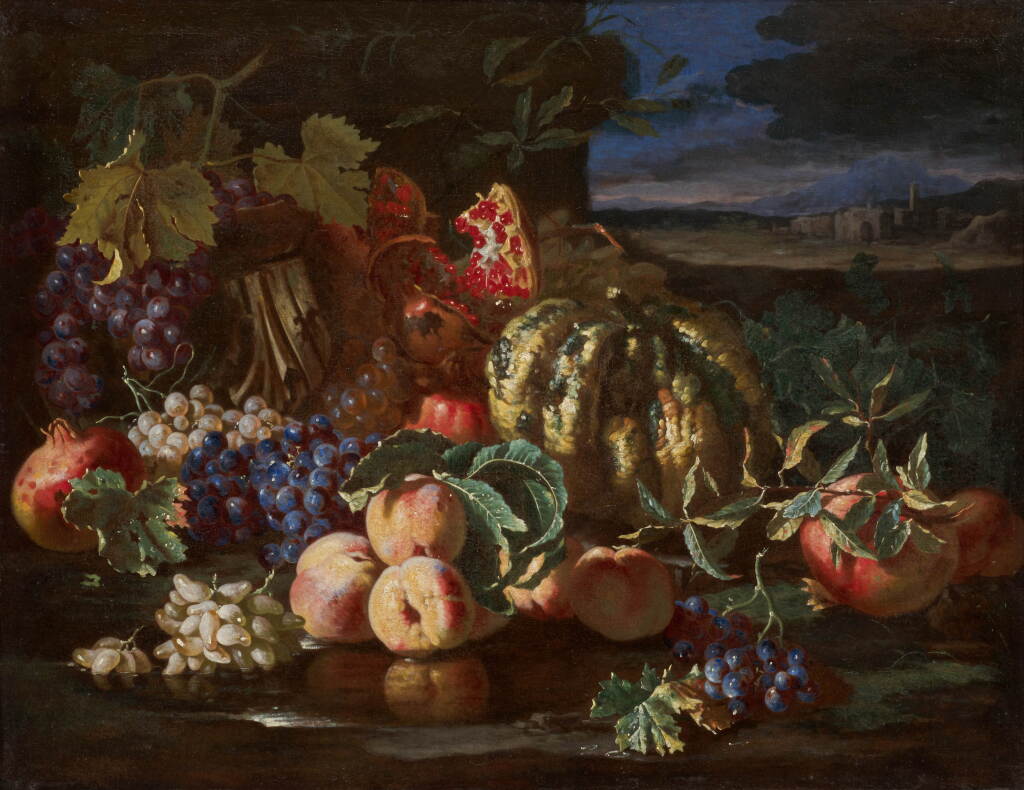 View full screen - View 1 of Lot 43. Still life of pomegranates, grapes, peaches and a fragment of a classical capital in a landscape, a town in the distance.