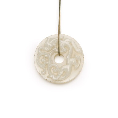 View full screen - View 1 of Lot 246. AN ARCHAISTIC WHITE JADE BI, QING DYNASTY, 18TH CENTURY | 清十八世紀 白玉雕螭龍紋璧.