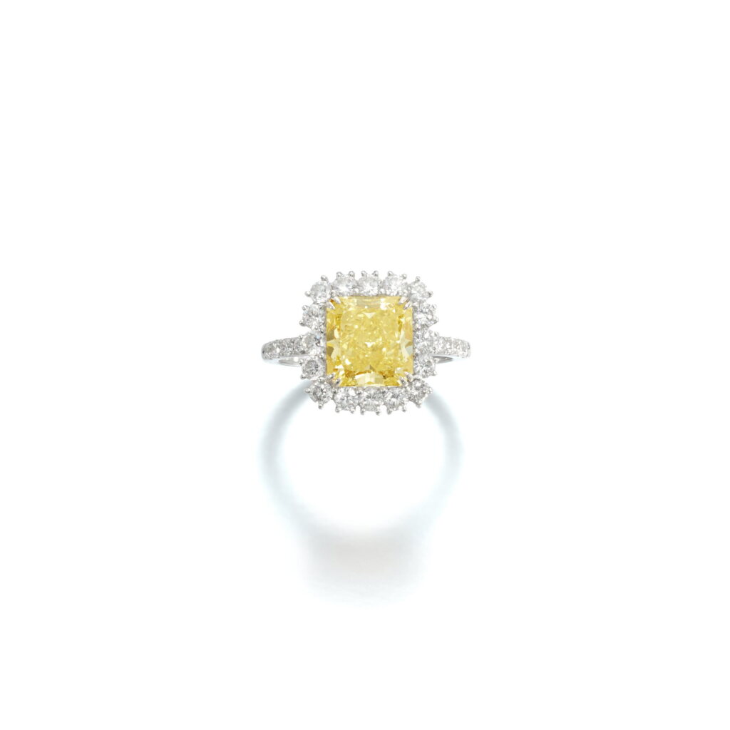 View full screen - View 1 of Lot 848. Fancy Yellow diamond and diamond ring .