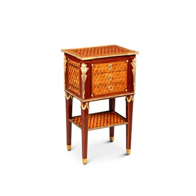 View full screen - View 1 of Lot 284. A Louis XVI gilt-bronze mounted amaranth, tulipwood and kingwood veneered table en chiffonière, circa 1780, attributed to Philippe-Claude Montigny | Table en chiffonière en amarante, bois de rose, bois de violette et bronze doré d'époque Louis XVI, vers 1780, attribuée à Philippe-Claude Montigny.