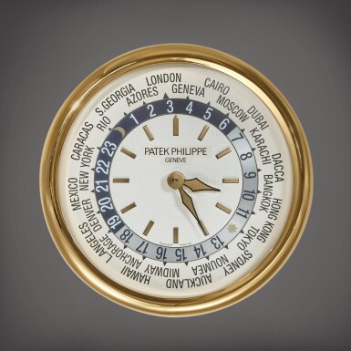 View full screen - View 1 of Lot 50. A large gilt brass wall clock with world time dial, Circa 2000.