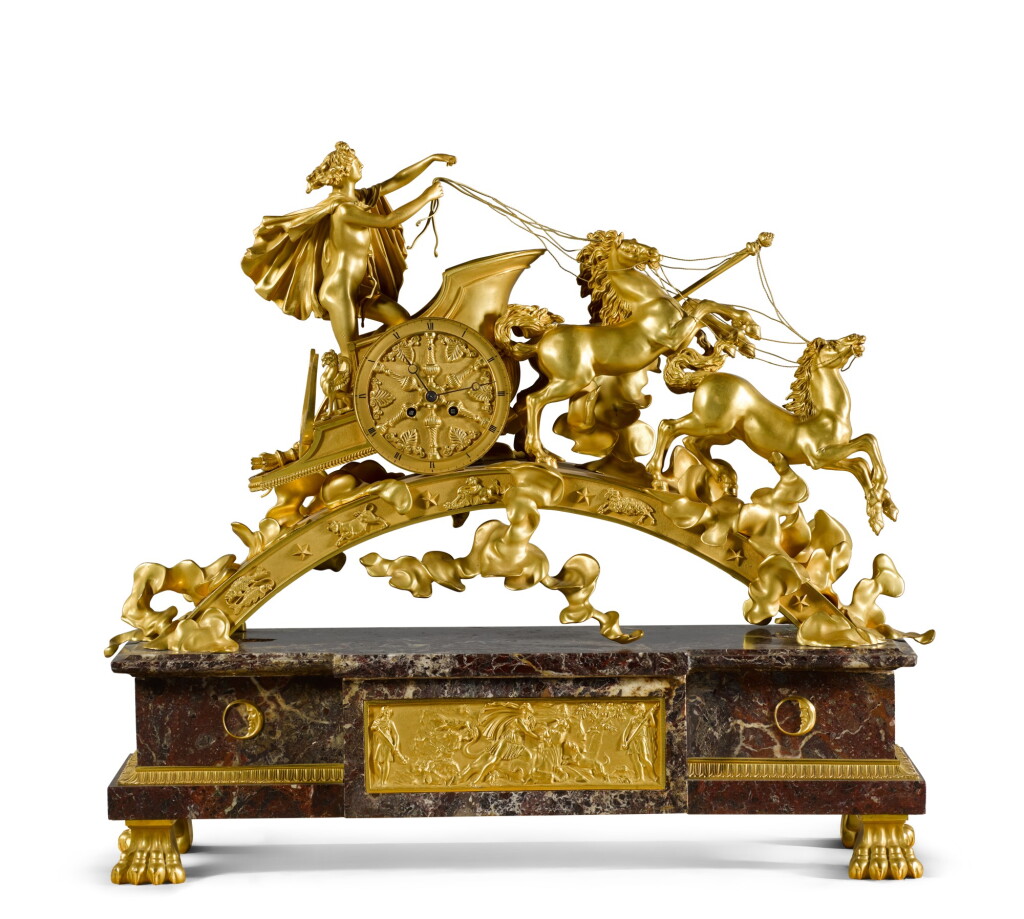 View full screen - View 1 of Lot 183. An Empire-style gilt-bronze and 'verde antico' marble chariot mantel clock in the manner of Pierre-Philippe Thomire, French, circa 1900.