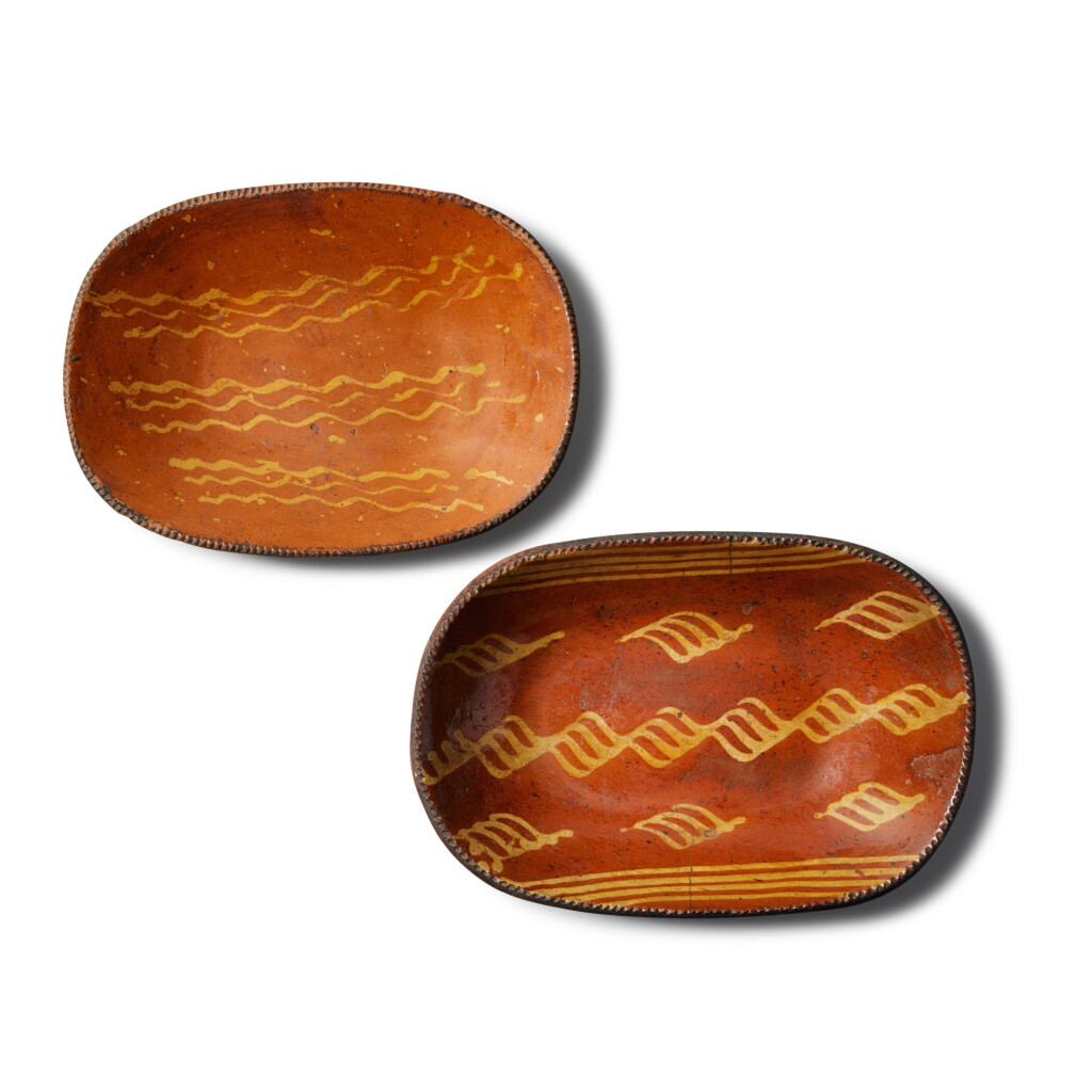 View full screen - View 1 of Lot 301. Two Slip-Decorated Glazed Red Earthenware Loaf Dishes, Pennsylvania, Early to Mid 19th century.