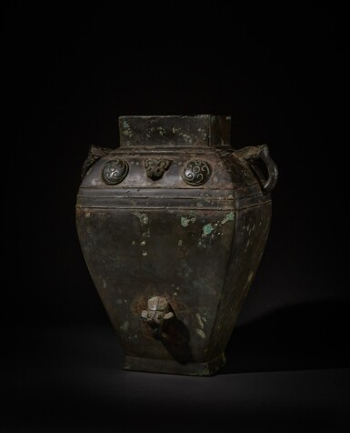 View full screen - View 1 of Lot 228. An archaic bronze ritual wine vessel (Fang lei), Late Shang / Early Western Zhou dynasty | 商末 / 西周初 青銅獸面渦紋方罍.