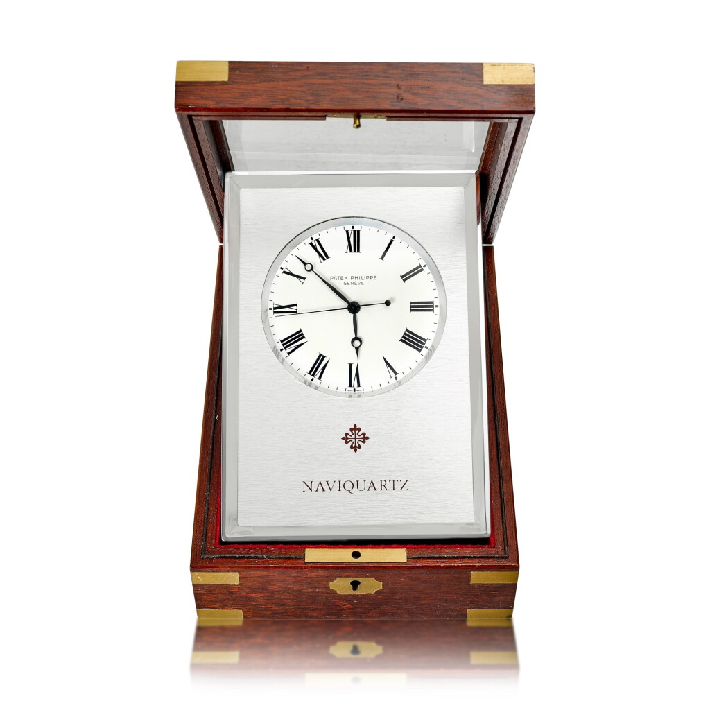 View full screen - View 1 of Lot 9382. Patek Philippe | Reference E1200, An aluminum table clock with fitted wooden case, Circa 1970 | 百達翡麗 | 型號E1200 鋁金屬座鐘,備木製盒子,約1970年製.