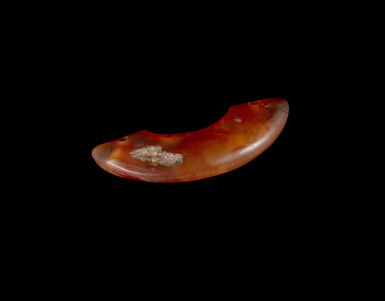 View full screen - View 1 of Lot 89. A red chalcedony pendant, huang, Neolithic period, Songze culture | 新石器時代 崧澤文化 紅玉髓璜.