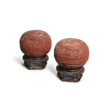View full screen - View 1 of Lot 216. A pair of carved cinnabar lacquer 'landscape' boxes and covers, Qing dynasty, Late 18th century | 清十八世紀末 剔紅開光山水圖圓蓋盒一對.