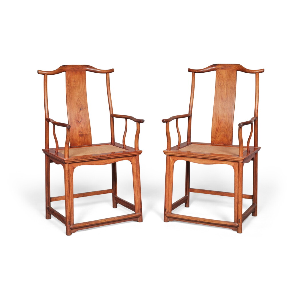 View full screen - View 1 of Lot 53. A pair of 'huanghuali' yokeback armchairs (Sichutou Guanmaoyi), 17th century.