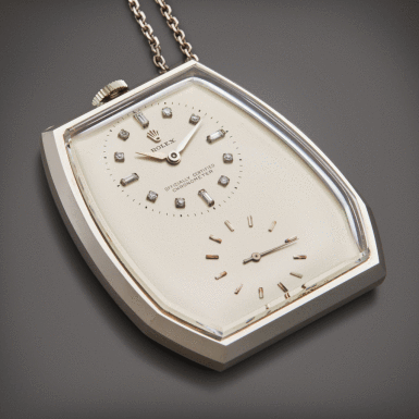 View full screen - View 1 of Lot 49. An unusual white gold and diamond-set open faced dress watch with clip, Circa 1946.