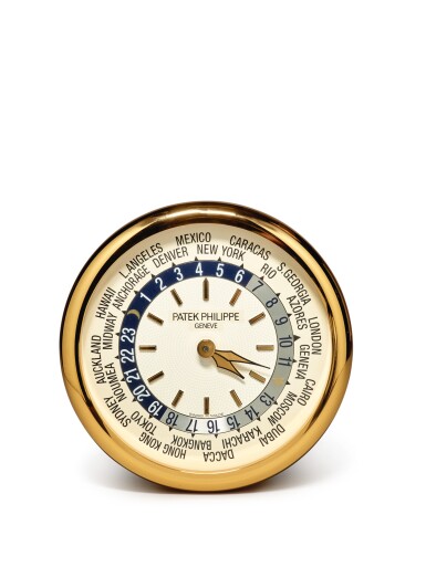View full screen - View 1 of Lot 42. PATEK PHILIPPE/INDUCTA | A LARGE GILT BRASS WALL CLOCK WITH WORLD TIME DIAL, CIRCA 2000.