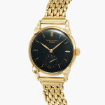 Calatrava, Reference 1547 | A yellow gold wristwatch with bracelet and black dial | Made in 1942